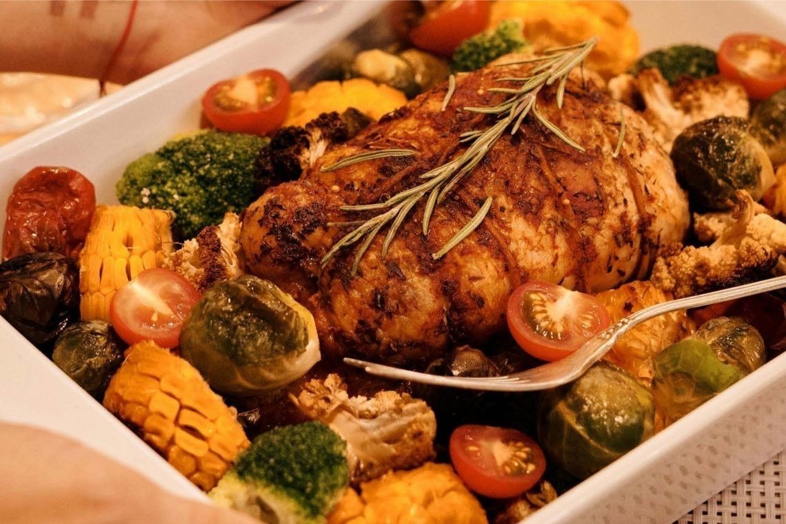 a bar with stools in front of a building