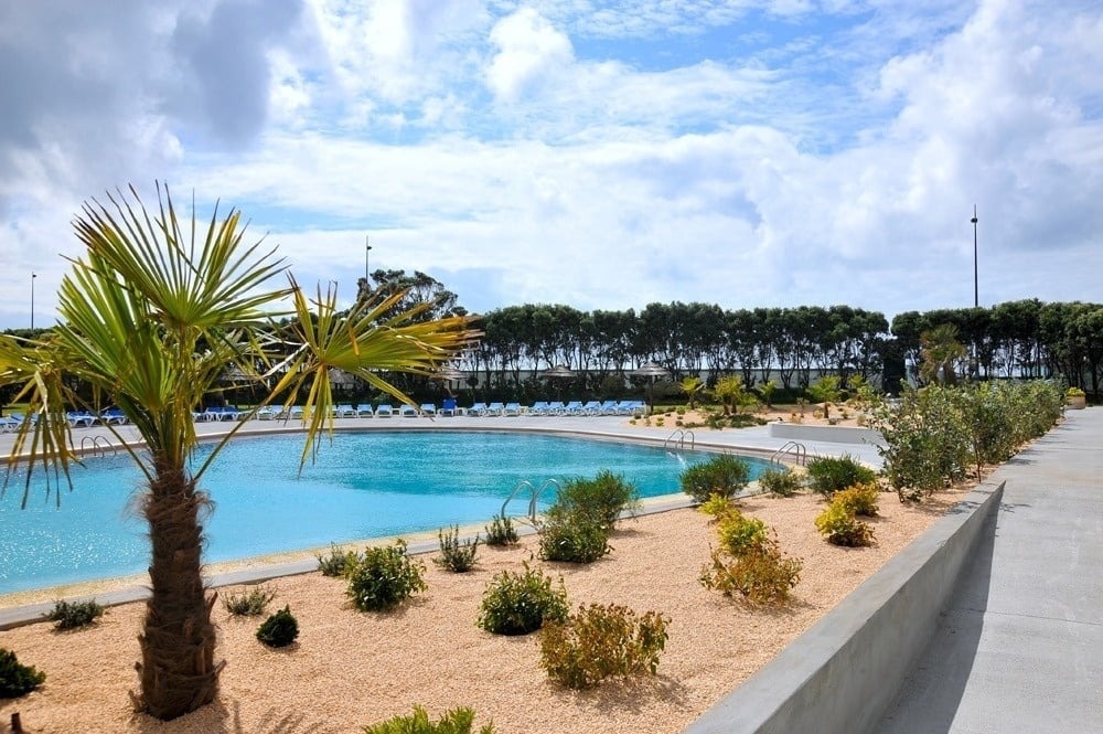 a group of people toasting with wine glasses and candles