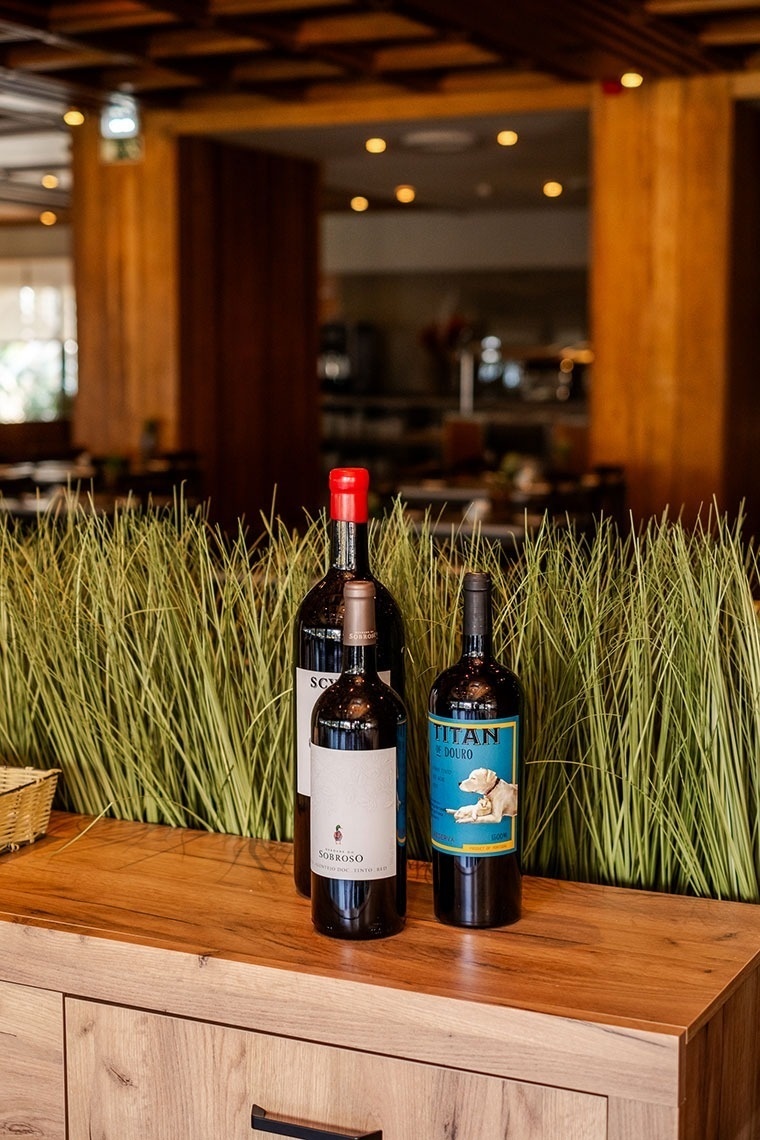 three bottles of wine one of which is titan