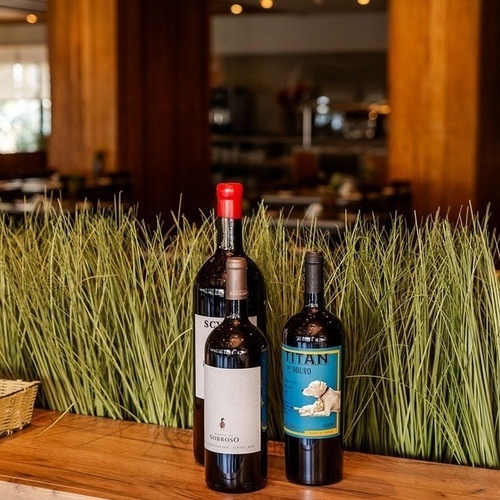 three bottles of wine one of which is titan