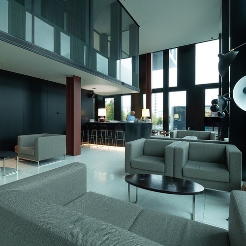 a room with a lot of chairs and a table