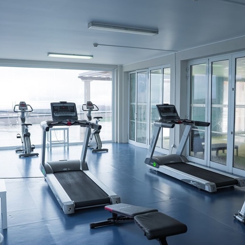 Gym with ocean view at Azoris Corporate.