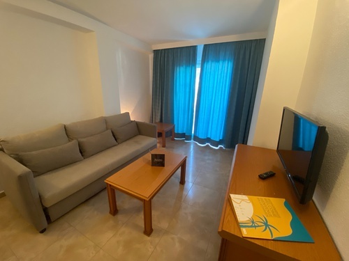 a living room with a couch and a flat screen tv