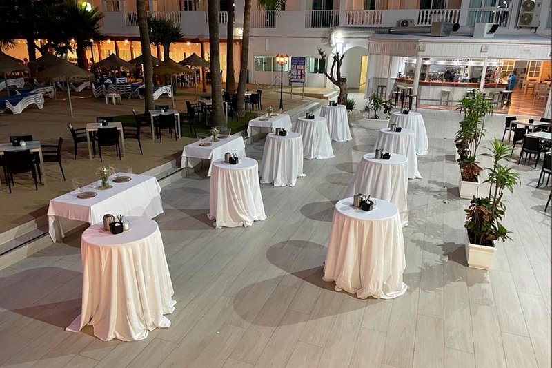 a restaurant with tables and chairs set up for a party