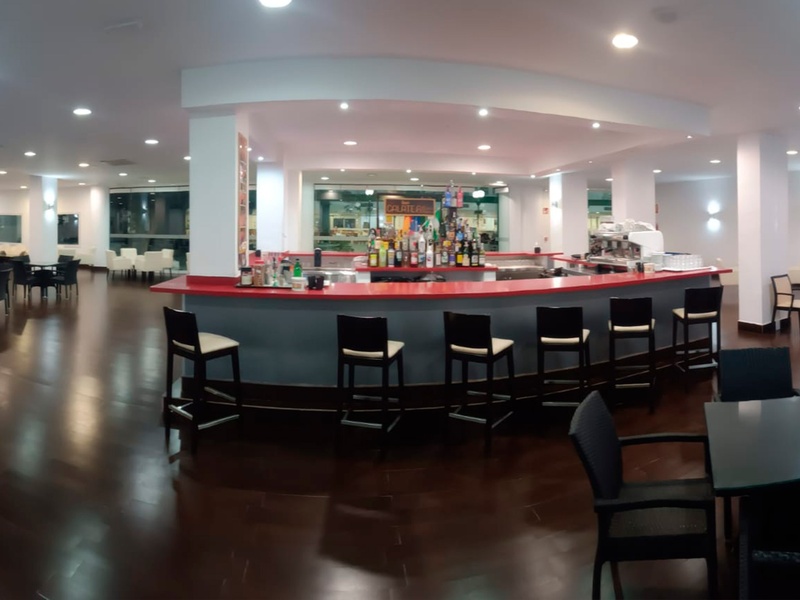 a buffet line with a sign on the floor that says 