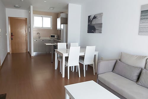 Bahia Serena modern living room with kitchen and dining area.
