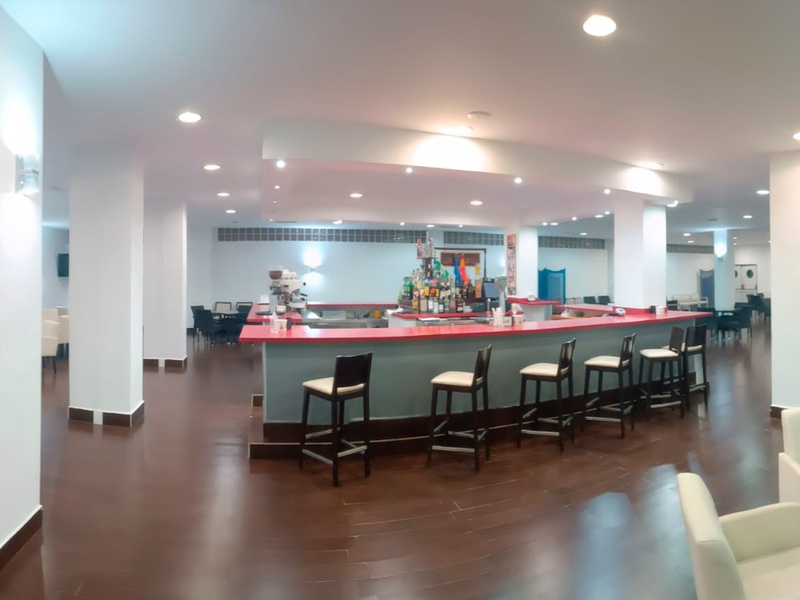 a buffet line in a restaurant with a blue line on the floor