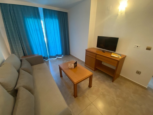 a living room with a couch and a television