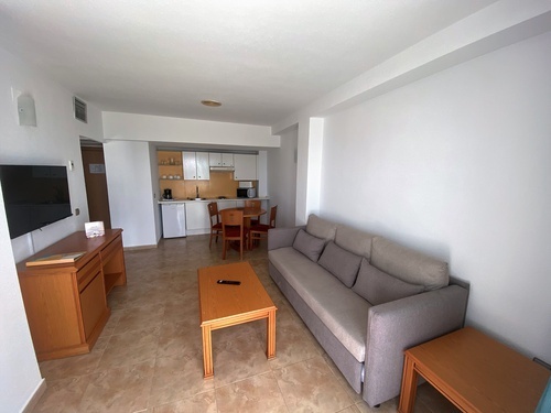 a living room with a couch and a television