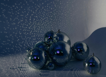 a bunch of disco balls are sitting on a table