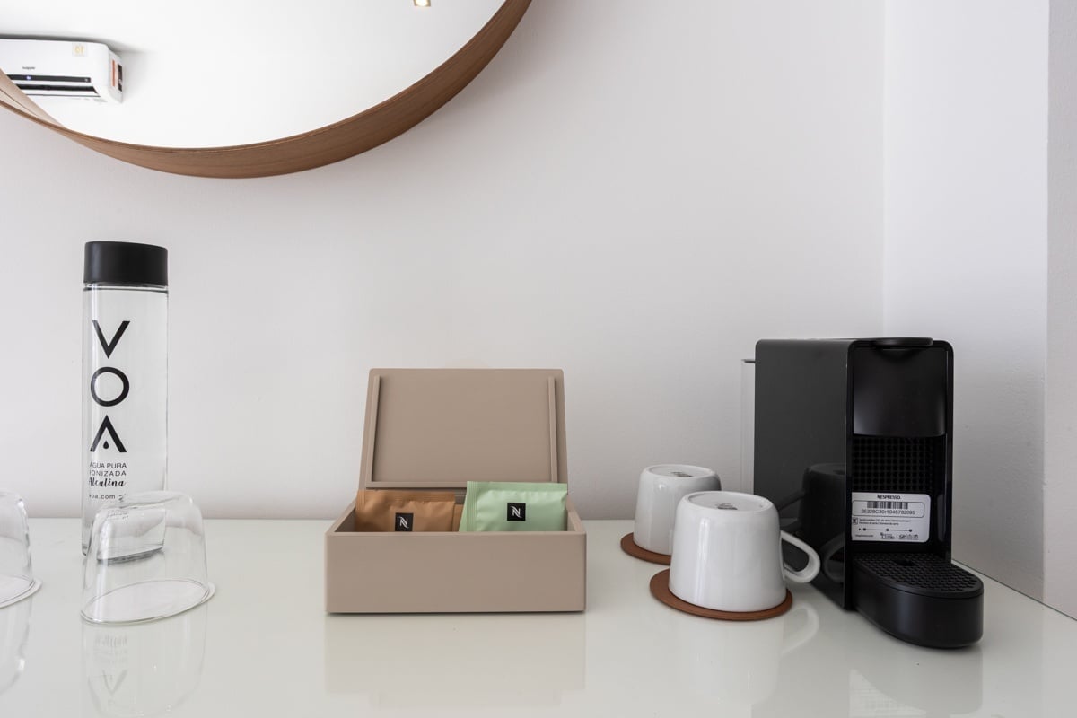 Hotel Baltum | Rooms: Coffee station with Nespresso, water, and cups.