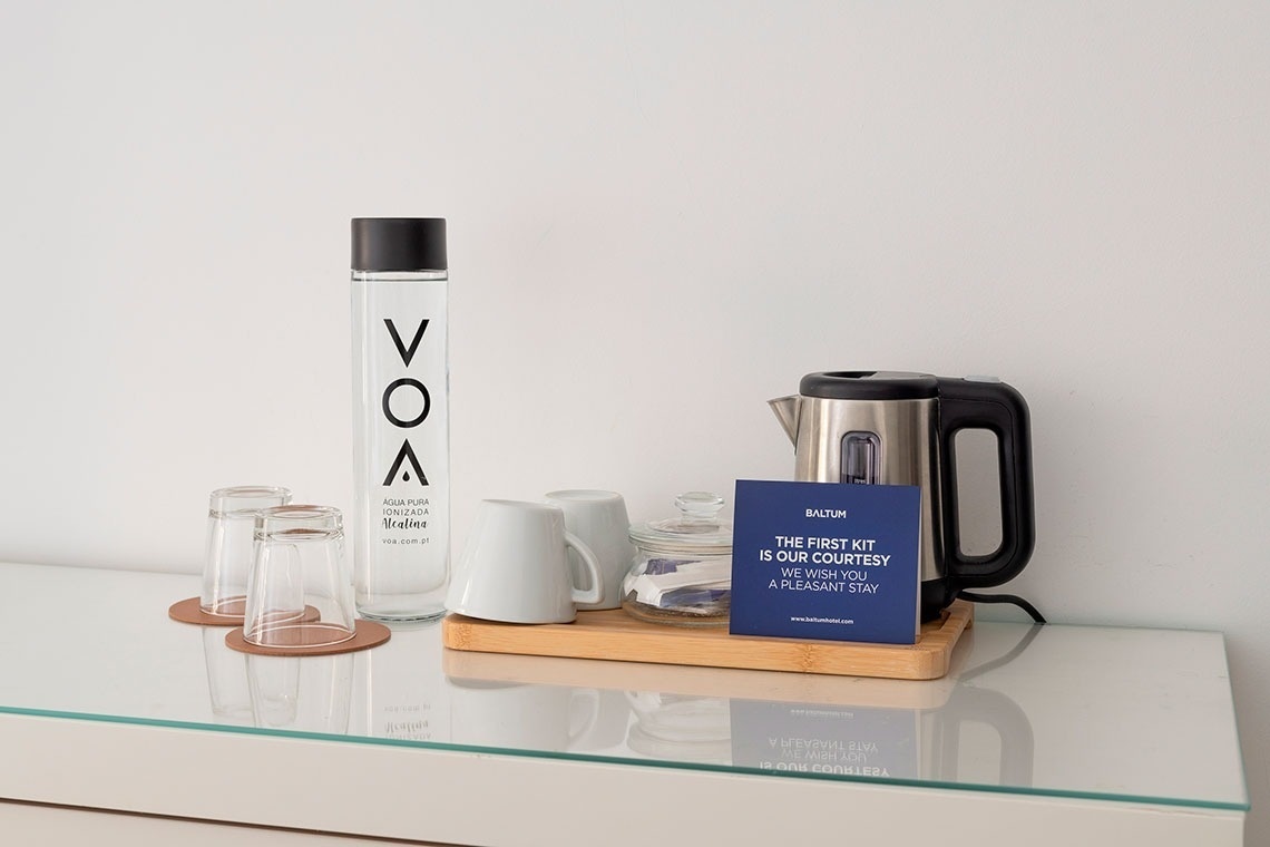 a bottle of vox vodka sits on a glass shelf