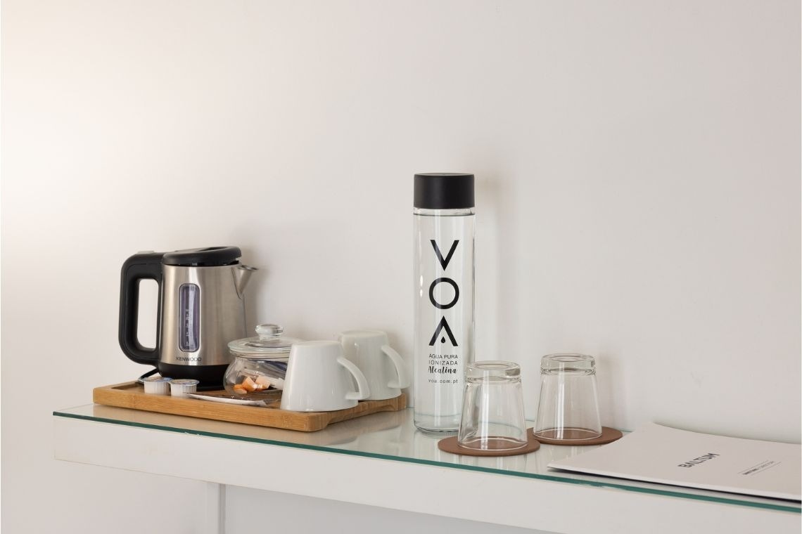 a bottle of vox water sits on a glass shelf