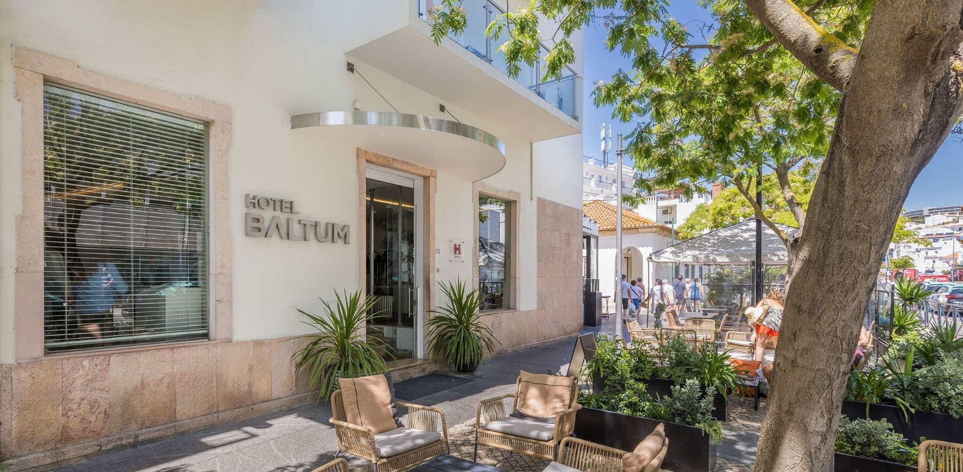 two bottles of real bubblegum sit on a bed