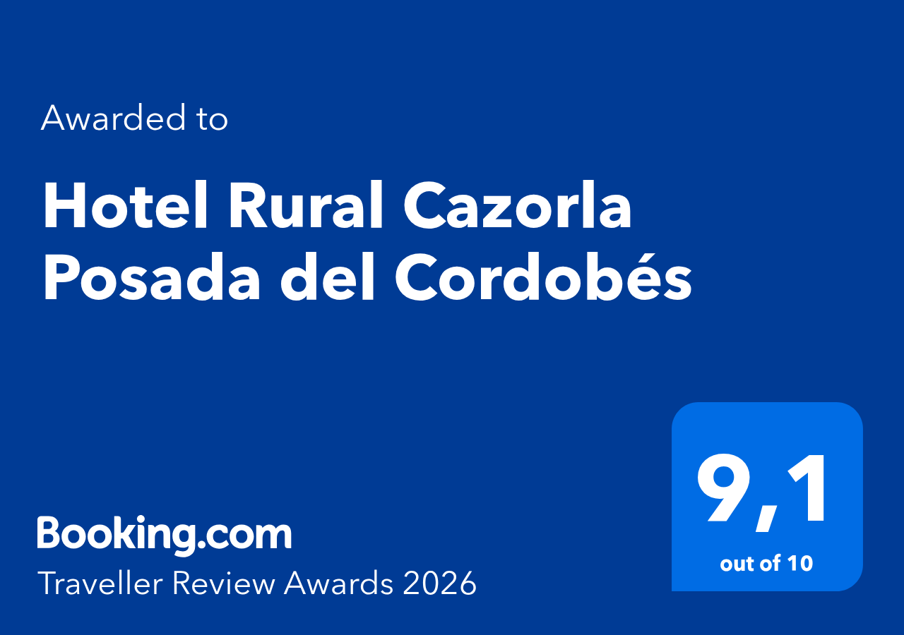 La imagen muestra un premio de Booking.com "Traveller Review Awards 2026" otorgado al "Hotel Rural Cazorla Posada del Cordobés" con una puntuación de 9,1 sobre 10.