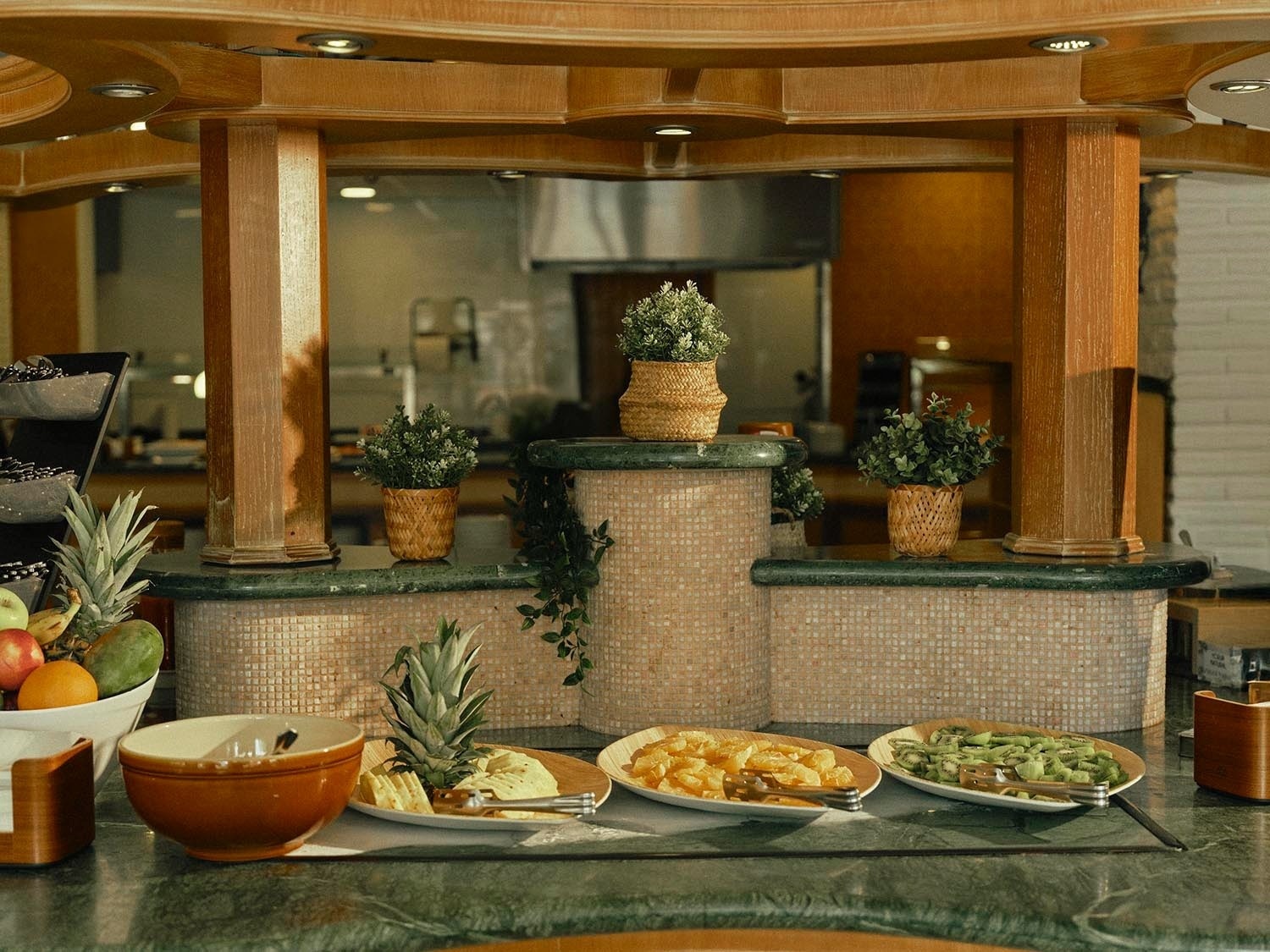 a red christmas ornament hangs from a tree branch
