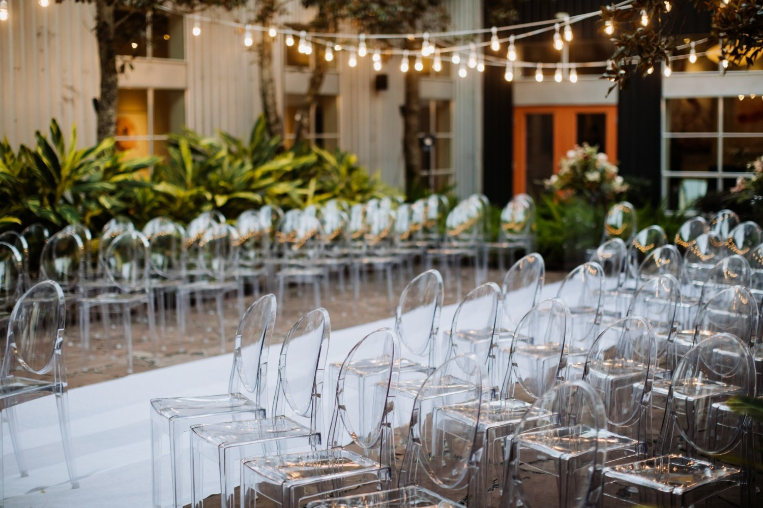 Clear ghost chairs arranged for events at Beneste Hotels. Official website.