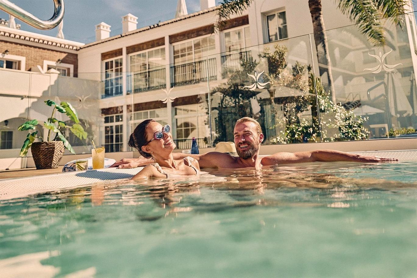 Couple enjoying pool. Experiences and Wellness | Beneste Hoteles Official Website