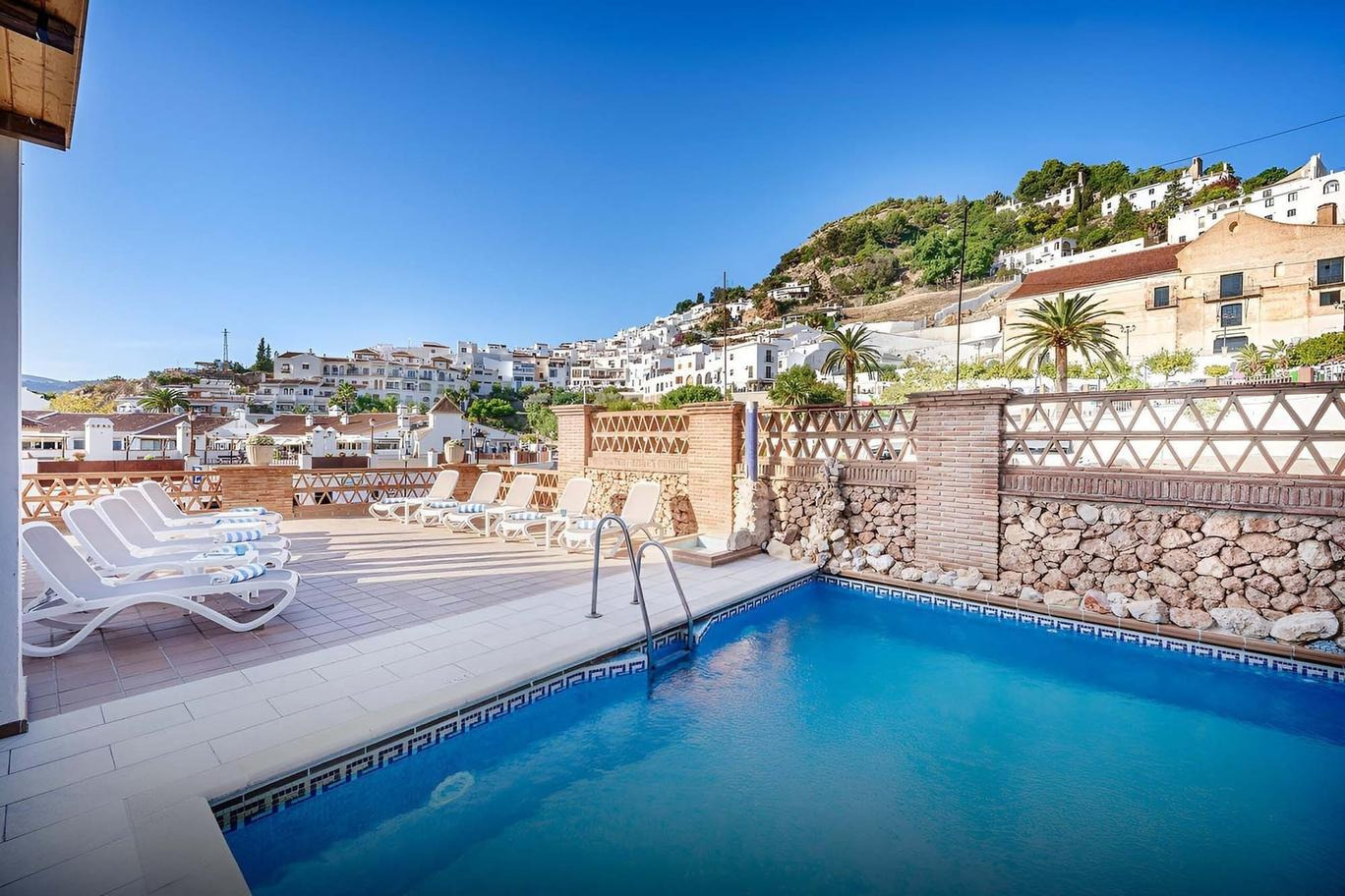 Frigiliana hotel pool with loungers and sea view. Book your stay at Beneste Hotels official website.
