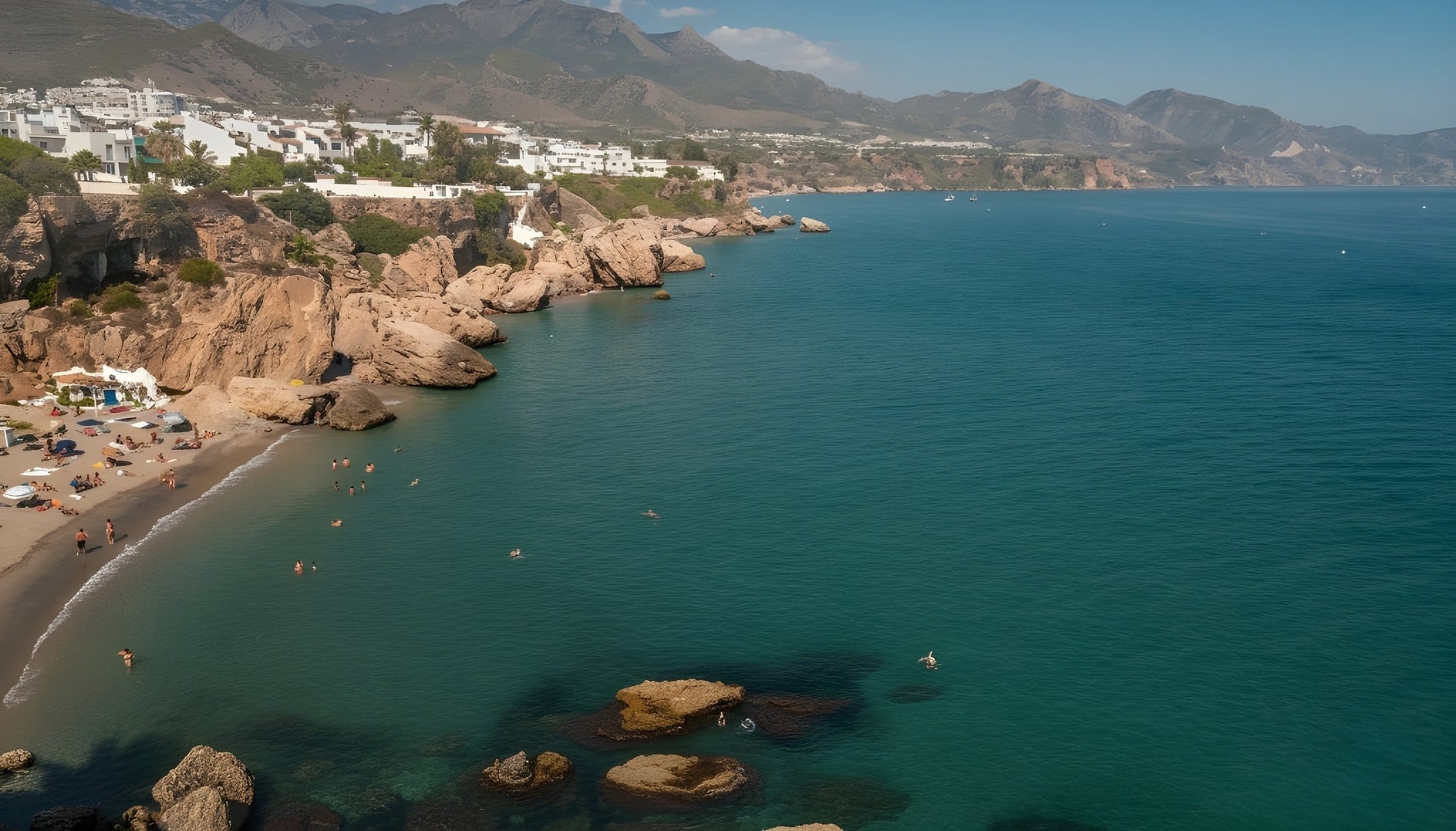 una mujer se sienta en una pared de piedra mirando el océano