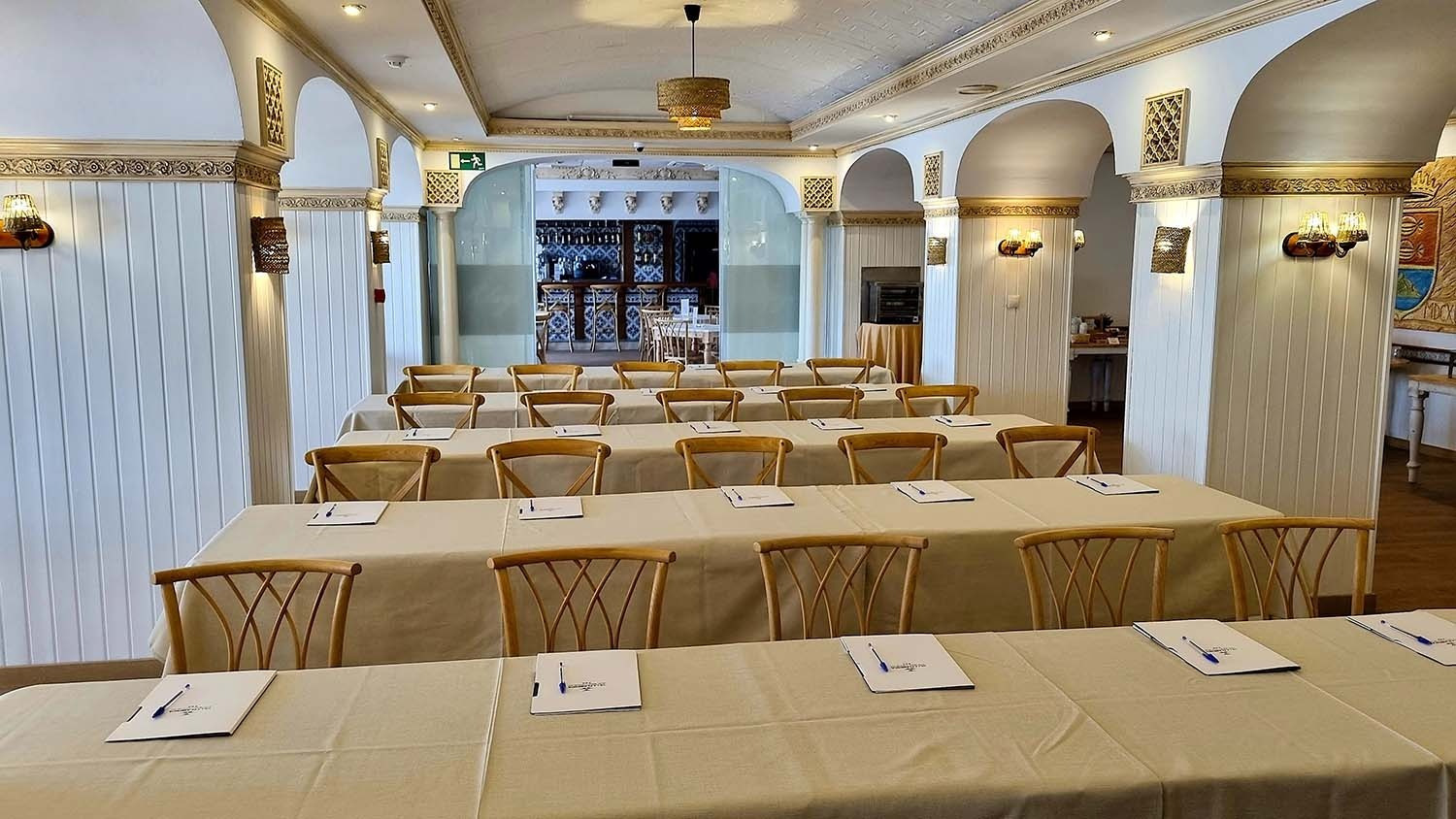 Conference room with tables & chairs, ready for events at Frigiliana Hotel. Book your event on the official Beneste Hotels website.