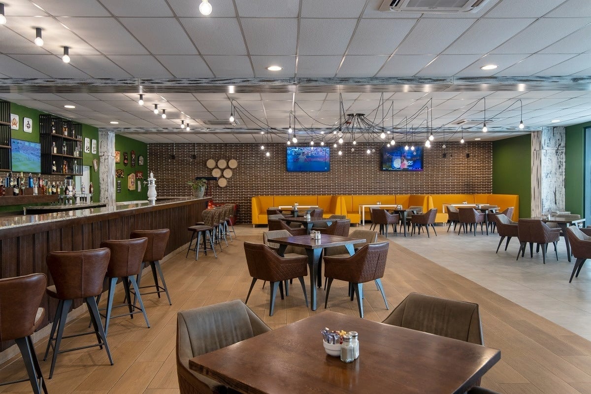 a restaurant with tables and chairs and a bar