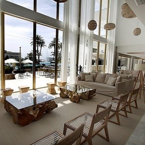 a living room with a couch a table and chairs