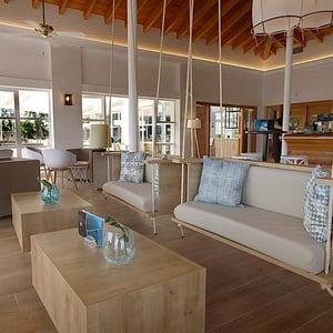 a living room with a couch hanging from the ceiling