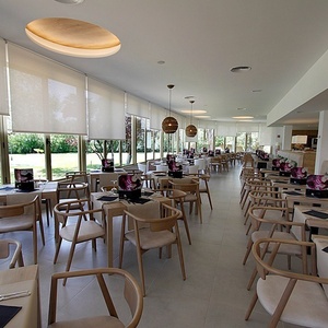 a restaurant with a lot of tables and chairs