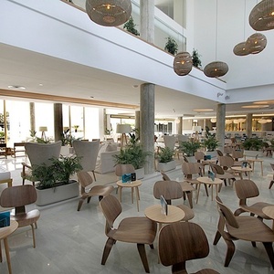 a large room with lots of chairs and tables