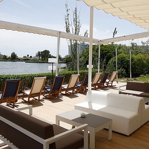 a patio with a view of a body of water