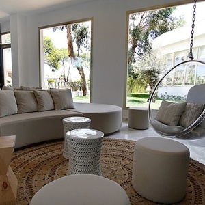 a room with a fire extinguisher and a hanging chair