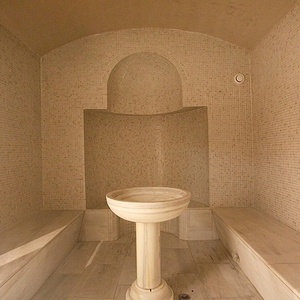 a bathroom with a pedestal sink in the middle