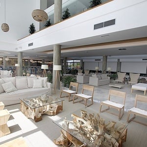 a living room with a couch and a table made of wood