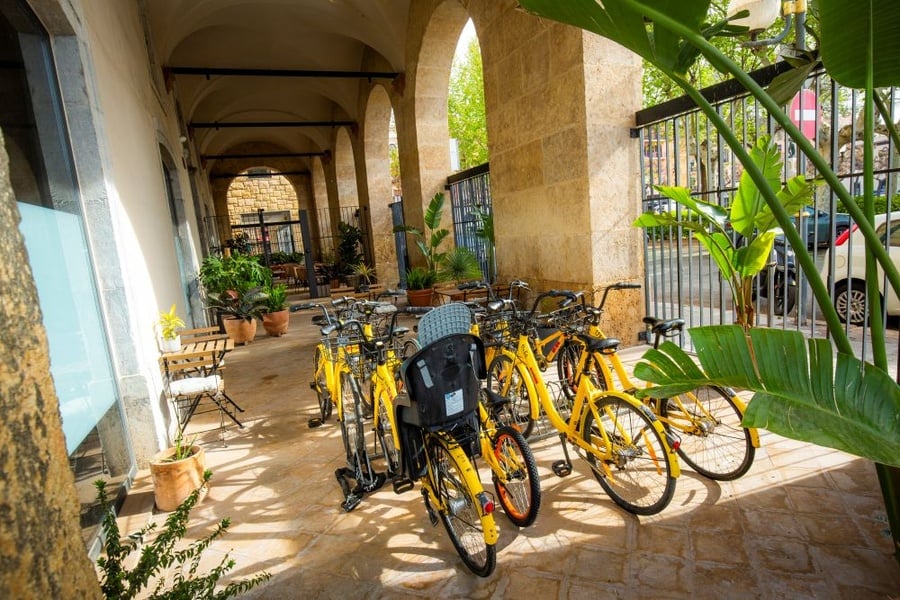 Bright yellow bikes available for guests at Grupo Blaumar: Port Plaza.