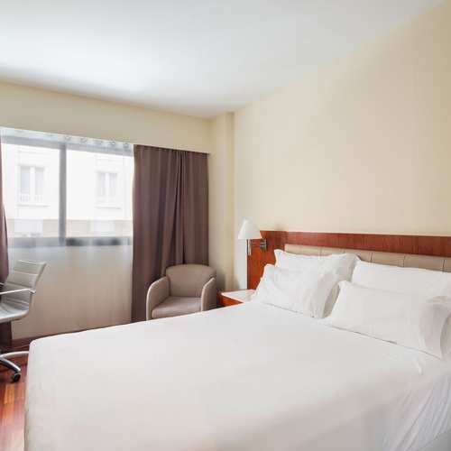 Cozy hotel room with a large bed and mirror. Bohemian Hotels style!