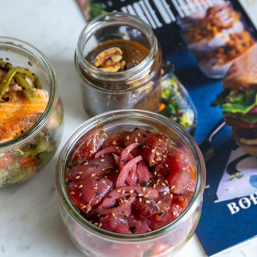 Fresh salmon and tuna poke bowls served at Bohemian Hotels.