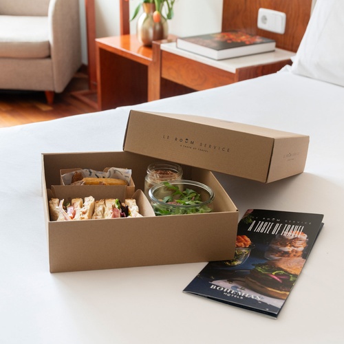 Bohemian Hotels room service meal with sandwiches, sides, and menu.