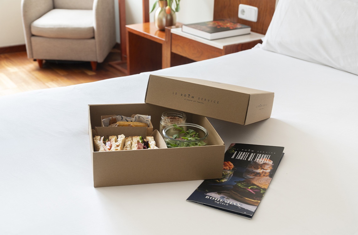 Bohemian Hotels room service: sandwiches, salad, and a menu.