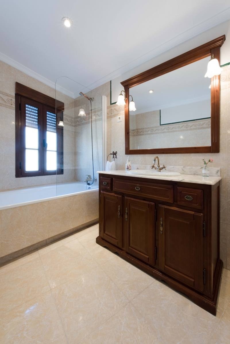 a bathroom with two sinks and a large mirror