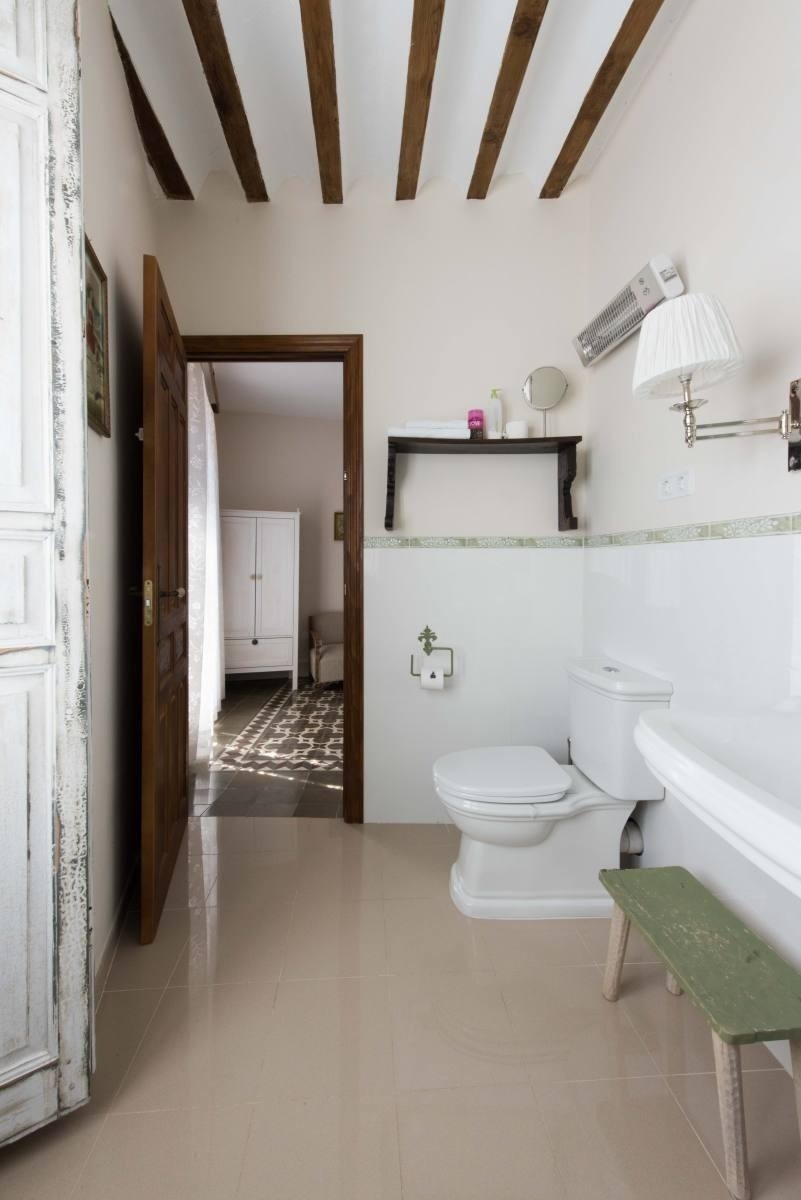 a bathroom with a toilet and a bathtub