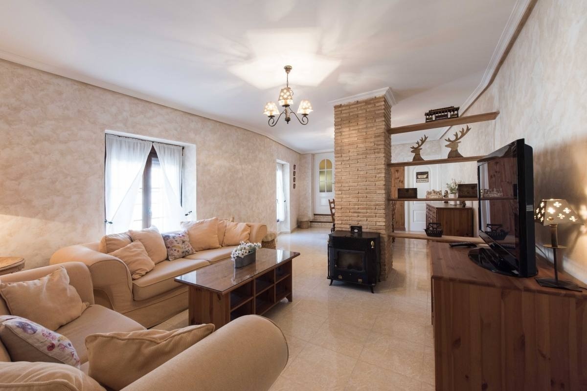 a living room with a couch and a flat screen tv