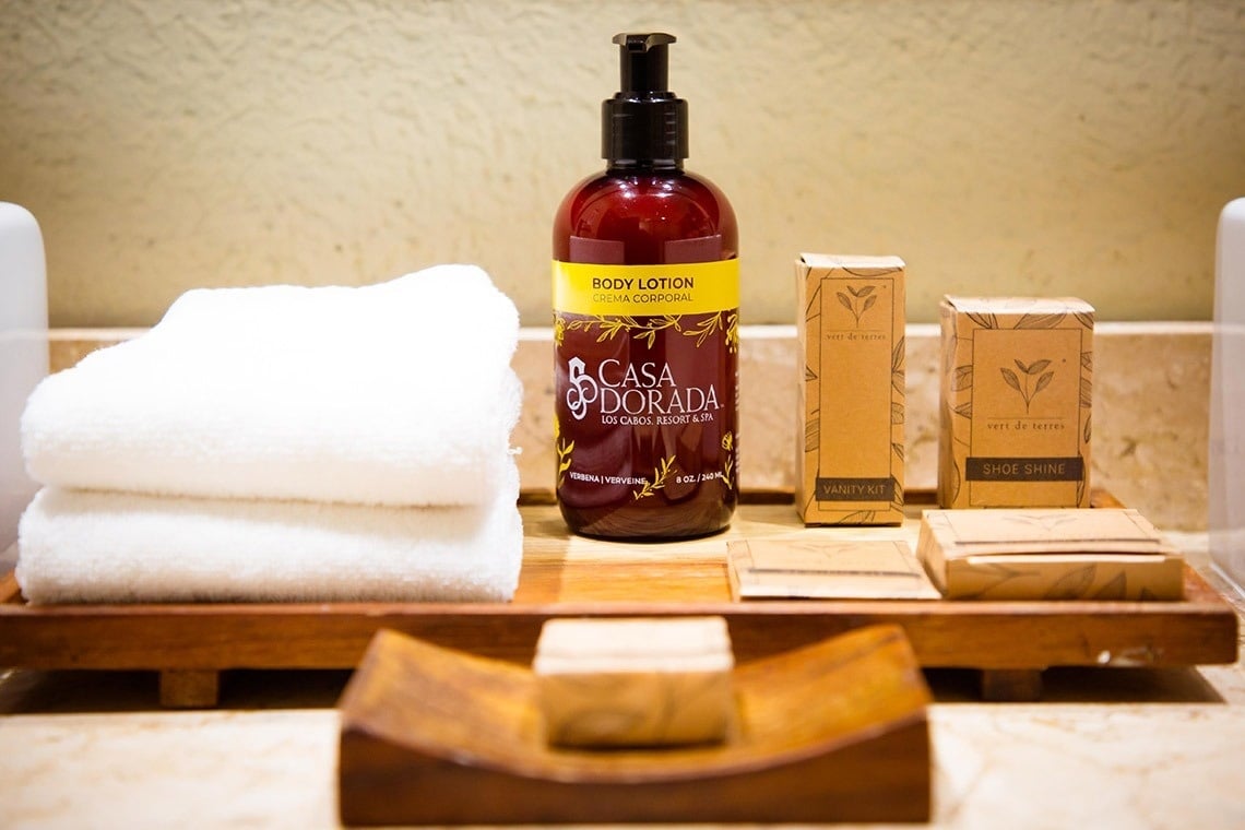 three bottles of casa dorada shampoo conditioner and shower gel