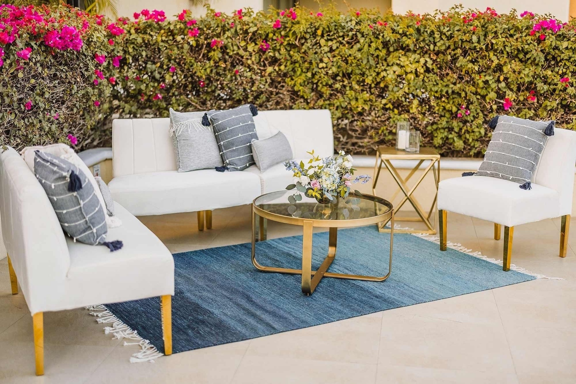 a long table with flowers and candles on it