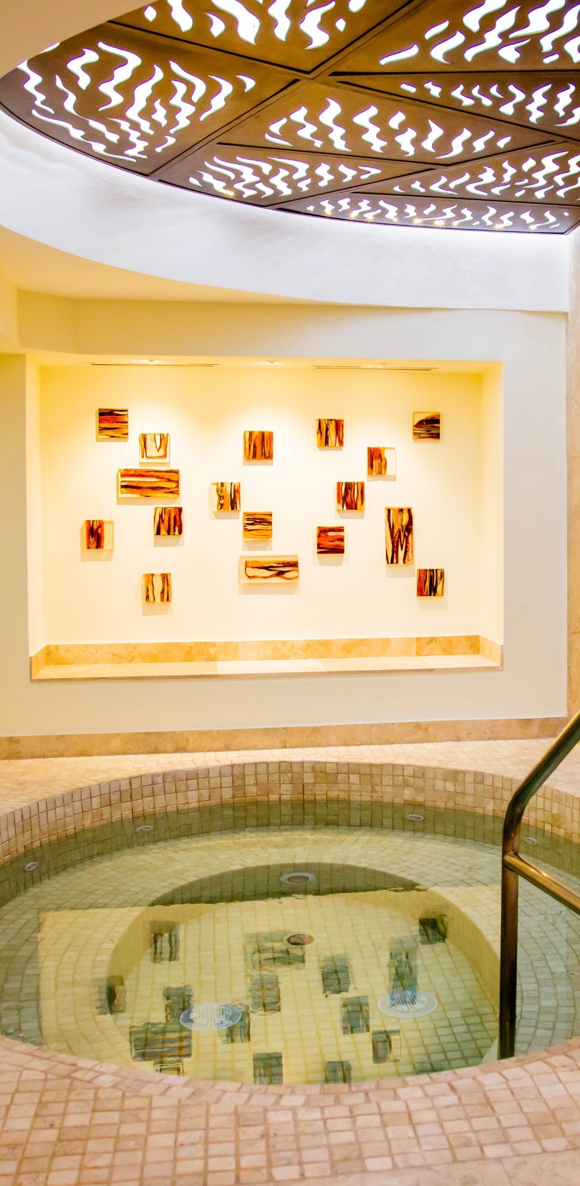 a swimming pool with a wall behind it that says ' a ' on it