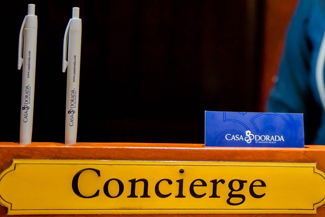 a yellow sign that says concierge on it