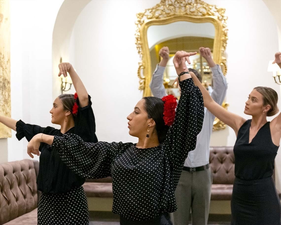 a group of people are dancing in front of a mirror