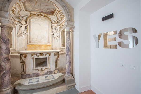 a white wall with the word yes on it