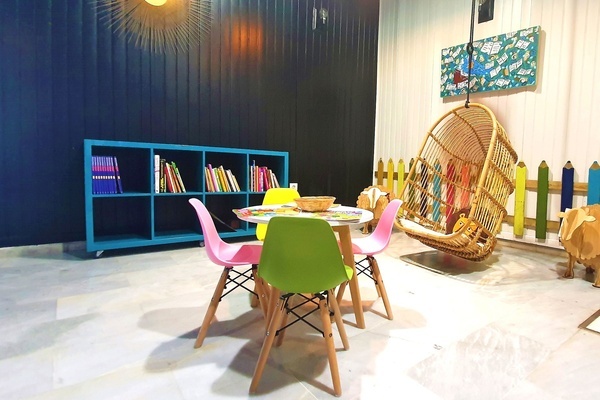 a children 's room with a table and chairs