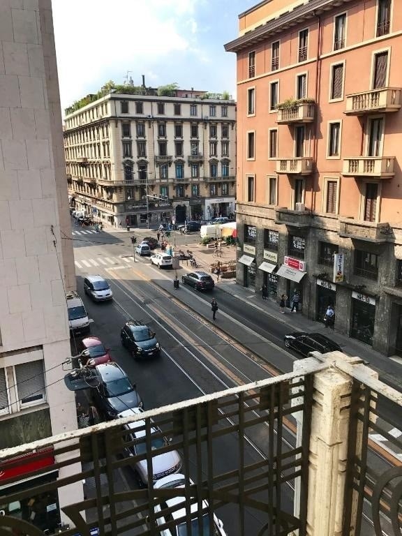 an aerial view of a city street with a sign that says ' caffe ' on it